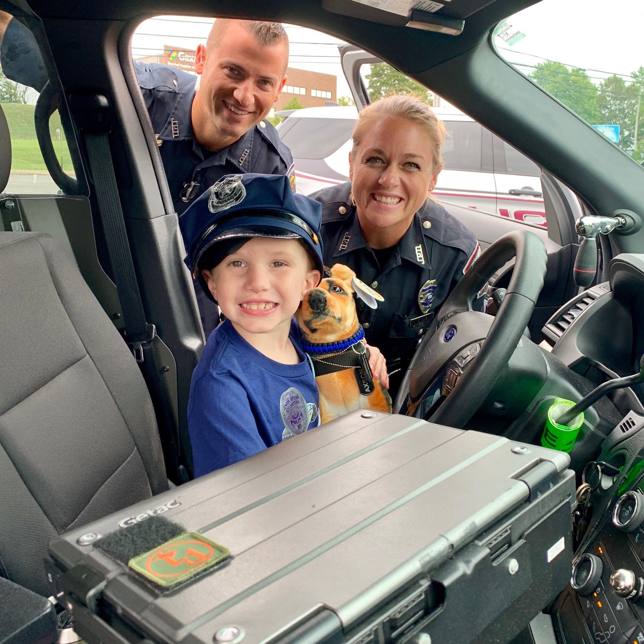 Jeffersontown Police officers connecting with a child